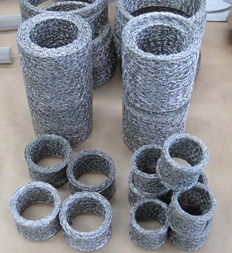 Stainless steel knitted wire mesh filter with different diameters and thickness.