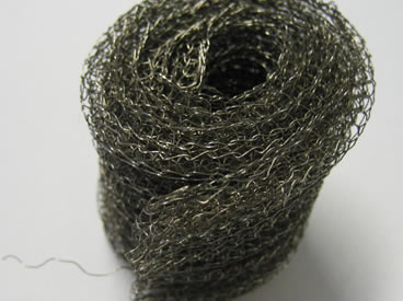 A roll of black wire knitted mesh filter