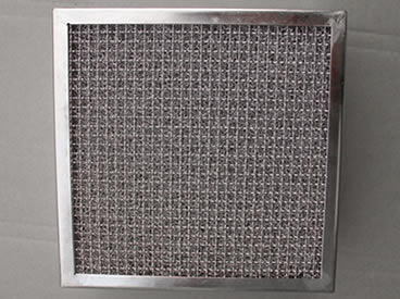 Layered knitted mesh and crimped mesh with steel frame used to make grease hood filters
